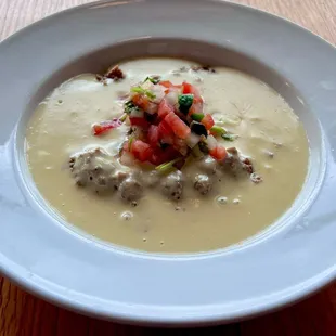 TNT Dip: Ground beef, pico de gallo, and creamy cheese dip combined for an unforgettable flavor explosion!