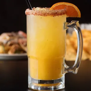 Mango Margarita: A sweet and refreshing blend of ripe mango and tequila, served with a salted rim for the perfect tropical twist!