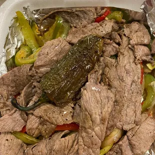 eef and peppers in a styrofoam container