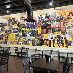 a wall covered with posters
