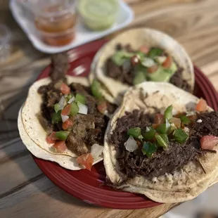 Clockwise, from left: tripas, lengua, and cabeza tacos  IG: @ohmyono