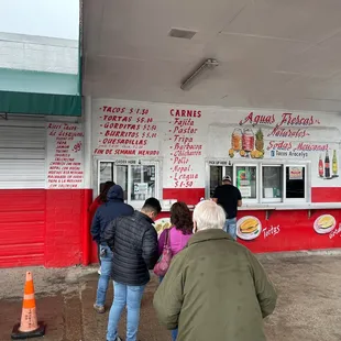 a line of people waiting to order food