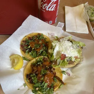 a can of coke and a sandwich