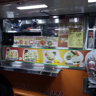 a man standing in front of a food truck