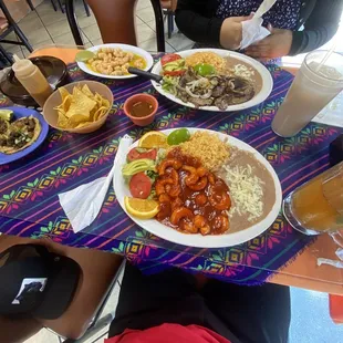 Camarones a la Diabla' with two tacos, Carne Asada' Plate with a side of garlic shrimp. Chips w/ salsa.