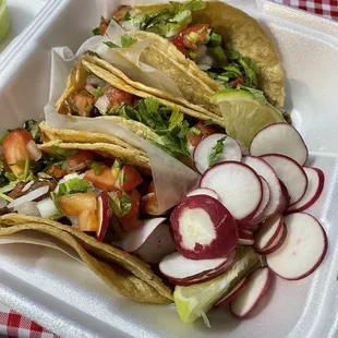 Three tacos: asada, pastor, and campechano