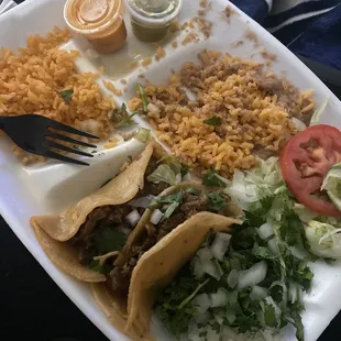 3 (steak fajita) Tacos and Arroz y Frijoles Plate