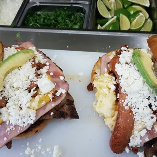 two sandwiches on a cutting board