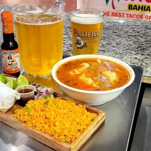 a plate of food and a beer