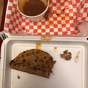Multiple pieces of melted plastic wrappers embedded in the meat of the quesabirria tacos. Disgusting!