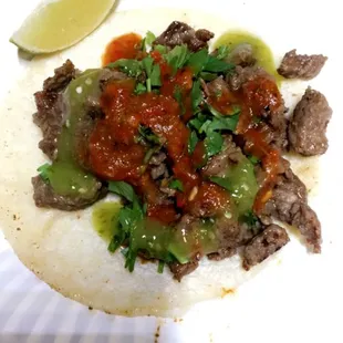 Asada tacos with some of our delicious red and green salsas!