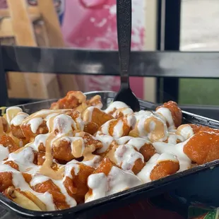 Buffalo chicken with fries. All the good foods are here. Come get a plate and eat.