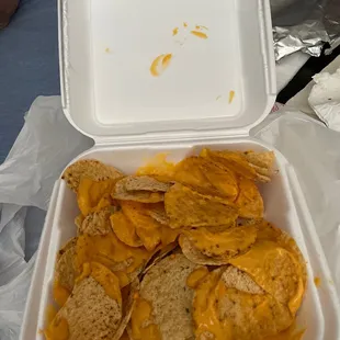 a container of chips and cheese