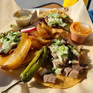 Street tacos served with grilled onions and jalapenos! Delicious!!