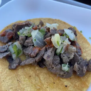 Carne asada tacos with corn tortillas