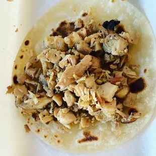 Chicken taco on flour tortilla