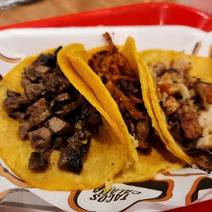 two tacoss on a tray