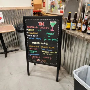 a chalkboard sign in a restaurant