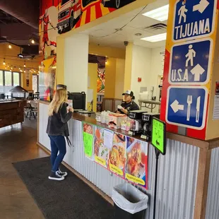 a woman standing at the counter