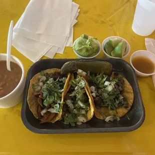 Beans, carne asada and al pastor. Love that they have grilled jalapeños and onion