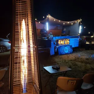 a patio with a fire pit