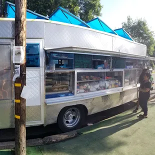 a food truck parked on the side of the road