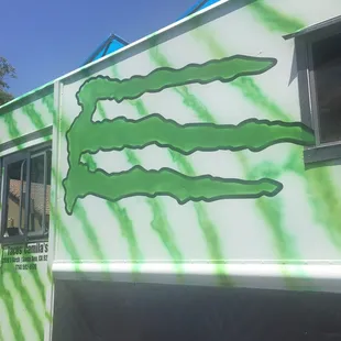 a taco truck with green paint