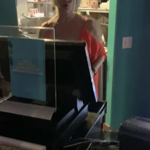 a woman behind a counter