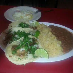 Taco special with rice and beans. Carnitas are made daily