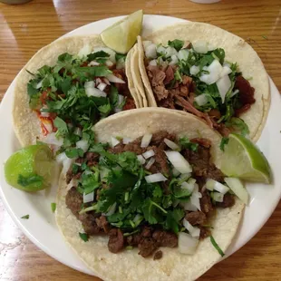 3 tacos: Carne asada, carnitas, and adobada.