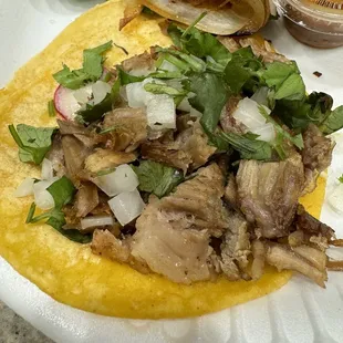 a taco with meat and vegetables