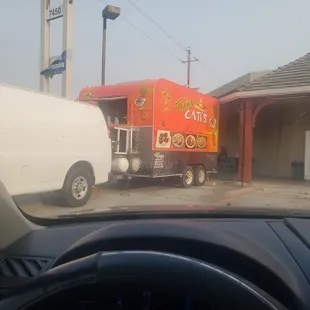 a taco truck in a parking lot