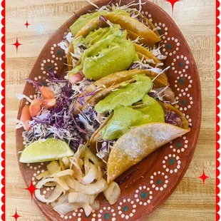 a plate of tacos on a table