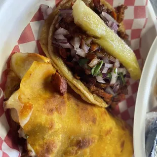 two tacoss on a plate