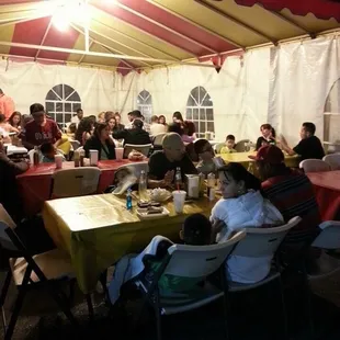 a group of people sitting around a table