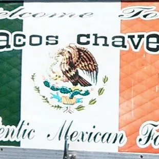 a mexican food truck with a mexican flag