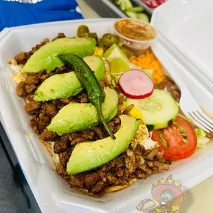 a meal in a styrofoam container