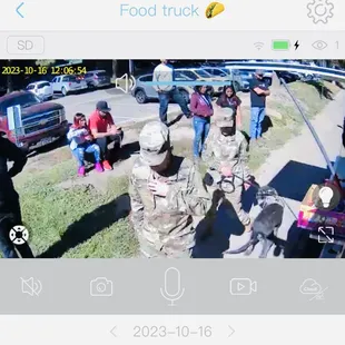 a group of people in a parking lot