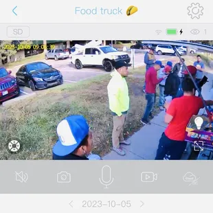 a group of people in a parking lot