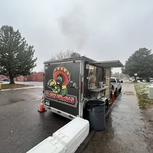 a taco truck parked in a parking lot