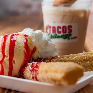 a plate of ice cream and churros