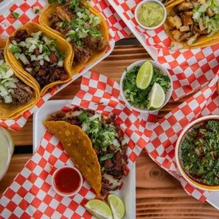 a variety of tacoss and drinks