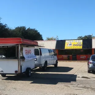 a taco truck parked in a parking lot