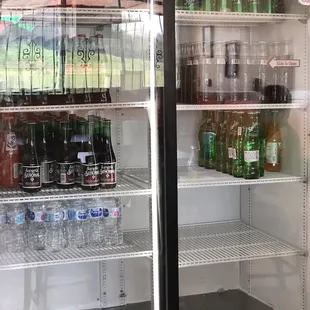 Coke and sprite cans Water and glass bottle drinks