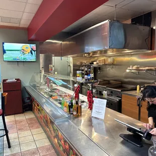 a woman ordering food at a restaurant