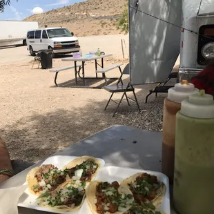 Carnitas (right) and alpastor (left) tacos