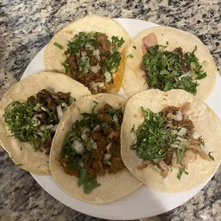 Clockwise from bottom...pastor, asada, chorizo, cabeza, tripa...all were excellent. Tripa was my favorite.
