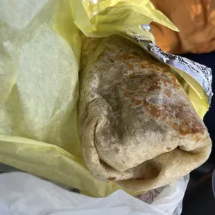 Asada burrito with sour cream and guacamole