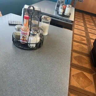 a table with drinks and condiments