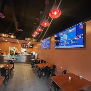 Beautiful restaurant with Extra wide Plasma screens. Sports .